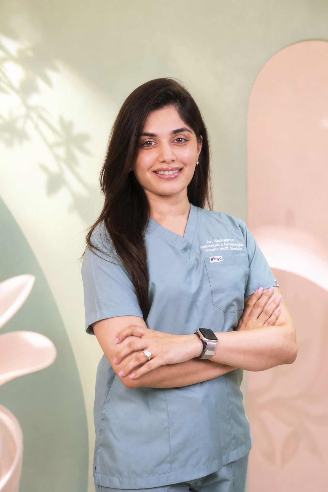 Dr. Aishwarya Parulekar Pai in her clinical scrubs